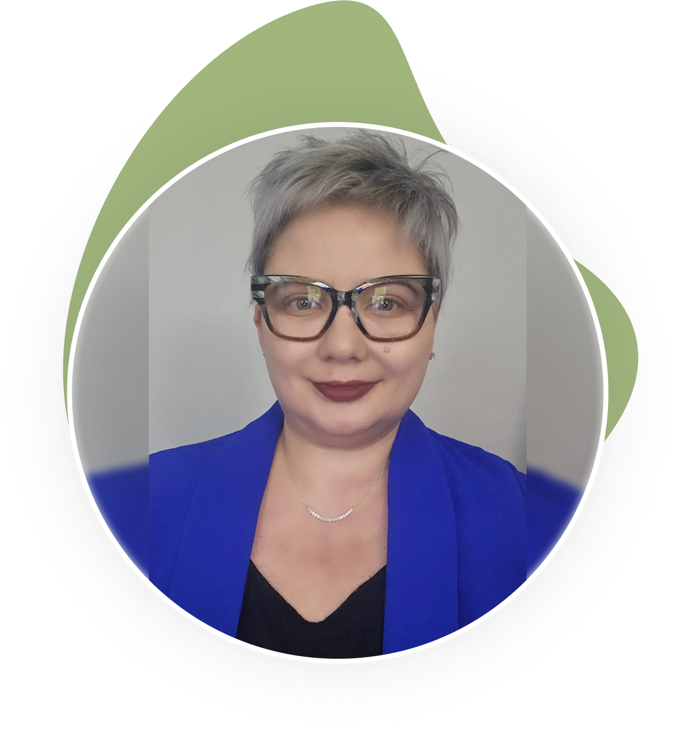 task4-1 A woman with glasses and short hair wearing a blue jacket.
